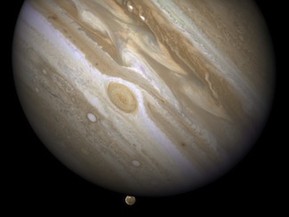 Jupiter about to eclipse one of its moons, Ganymede, in 2007. Ganymede circles Jupiter about once a week, but this particularly useful occultation, which allowed scientists to measure the haziness of Jupiter Jupiter about to eclipse one of its moons, Ganymede, in 2007. Ganymede circles Jupiter about once a week, but this particularly useful occultation, which allowed scientists to measure the haziness of Jupiter