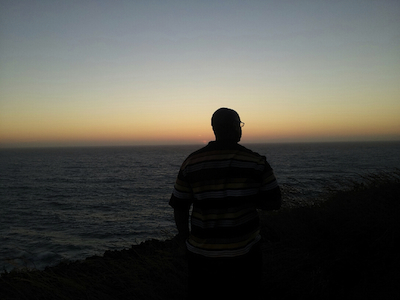 Jordan Merrell, who formerly wrote for Planet Waves under the name Enceno Macy, looks to the sea on his way to visit his mother for the first time after his release.