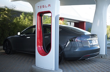 A Model S at a Supercharger station; photo by Tesla Motors.