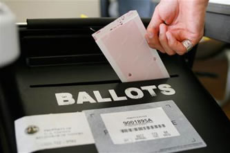 ballot A paper ballot is placed in a ballot box in this file photo from the 2006 California Primary Election. Photo by Damian Dovarganes / AP.