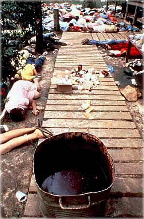 Aftermath of the suicides. The vat containing the poison is visible in the foreground. Aftermath of the suicides. The vat containing the poison is visible in the foreground.