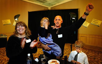 prop-8-family-2 Lisa Wasson, her daughter Sarah, 5, husband Kirk, and son Judah, 7, of Moreno Valley celebrate the early returns for Proposition 8 at an Irvine hotel. The couple and their six children were active in supporting the proposition. Photo by Rick Loomis / Los Angeles Times.