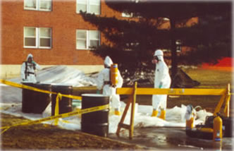 hasmat Hardly anyone remembers when the campus looked like this. This photo of cleanup crews with independent air supply working outside Bliss Hall in January 1992. Photo by Eric Francis for Student Leader News Service.