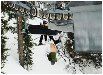 Man is left dangling and pant-less from a Colorado ski lift. Photo taken by a fellow skiier.