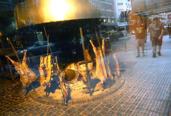 If you like red meat, youВґll love Argentina. Here animal remains get grilled up in the front window of a steakhouse on Avenida Cordoba. Photo by Danielle Voirin.