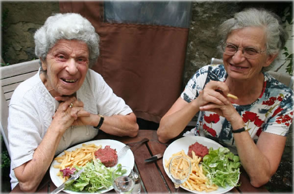 Paris ladies about to dive into their steak tartar. Photo by Eric Francis. 