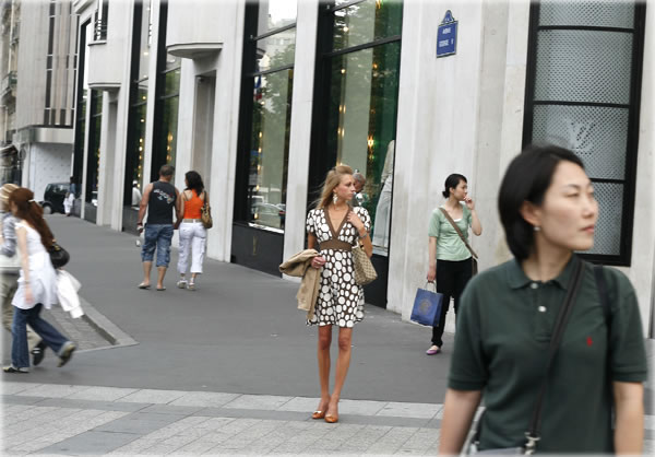 Waiting for someone or something, on a corner of the Champs Elysees, Paris. Photo by Dani Voirin. Waiting for someone or something, on a corner of the Champs Elysees, Paris. Photo by Dani Voirin.