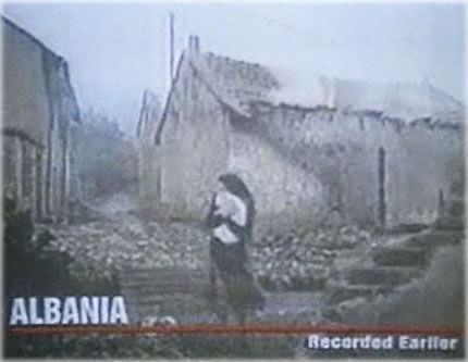 Deeply touching and totally fake image of a girl running for shelter with her cat in вЂњAlbania,вЂќ from the 1997 masterpiece Wag the Dog. Screen grab taken from official movie trailer.