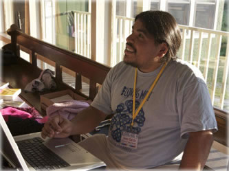 Chuy Garcia works the registration desk at the Loving More east coast conference. Photo by Eric Francis. Chuy Garcia works the registration desk at the Loving More east coast conference. Photo by Eric Francis.