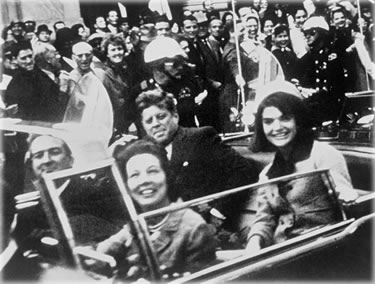 President and Mrs. Kennedy, and Governor and Mrs. Connoly, ride in an open limousine minutes before the assassination. Photo by Victor Hugo King. President and Mrs. Kennedy, and Governor and Mrs. Connoly, ride in an open limousine minutes before the assassination. Photo by Victor Hugo King.