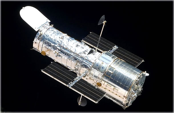 The Hubble Space Telescope (HST) is a space telescope that was carried into orbit by the space shuttle in April 1990. It is named after the American astronomer Edwin Hubble. Although not the first space telescope, Hubble is one of the largest and most versatile, and is well-known as both a vital research tool and a public relations boon for astronomy. The Hubble Space Telescope (HST) is a space telescope that was carried into orbit by the space shuttle in April 1990. It is named after the American astronomer Edwin Hubble. Although not the first space telescope, Hubble is one of the largest and most versatile, and is well-known as both a vital research tool and a public relations boon for astronomy.