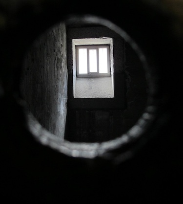 View through the door of a cell in Kilmainham Gaol, Dublin, Ireland. The former prison is now a museum. Photo by Hal J. Cohen.