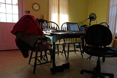 My kitchen table desk, where I recorded and wrote most of Rev Rev Reality Check. Photo by Eric.