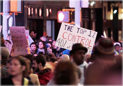 The heart of the matter: sign saying that the richest 1% of Americans control 40% of the wealth. Photo by Eric Francis.