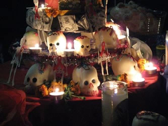 Sugar skulls adorn an ofrenda. Photo taken at the Dia de los Muertos Celebration at Union Plaza, El Paso, Texas, November 2, 2007. Photographer unknown.