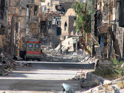 A general view shows a heavily damaged street in Syria's eastern town of Deir Ezzor on August 26, 2013.