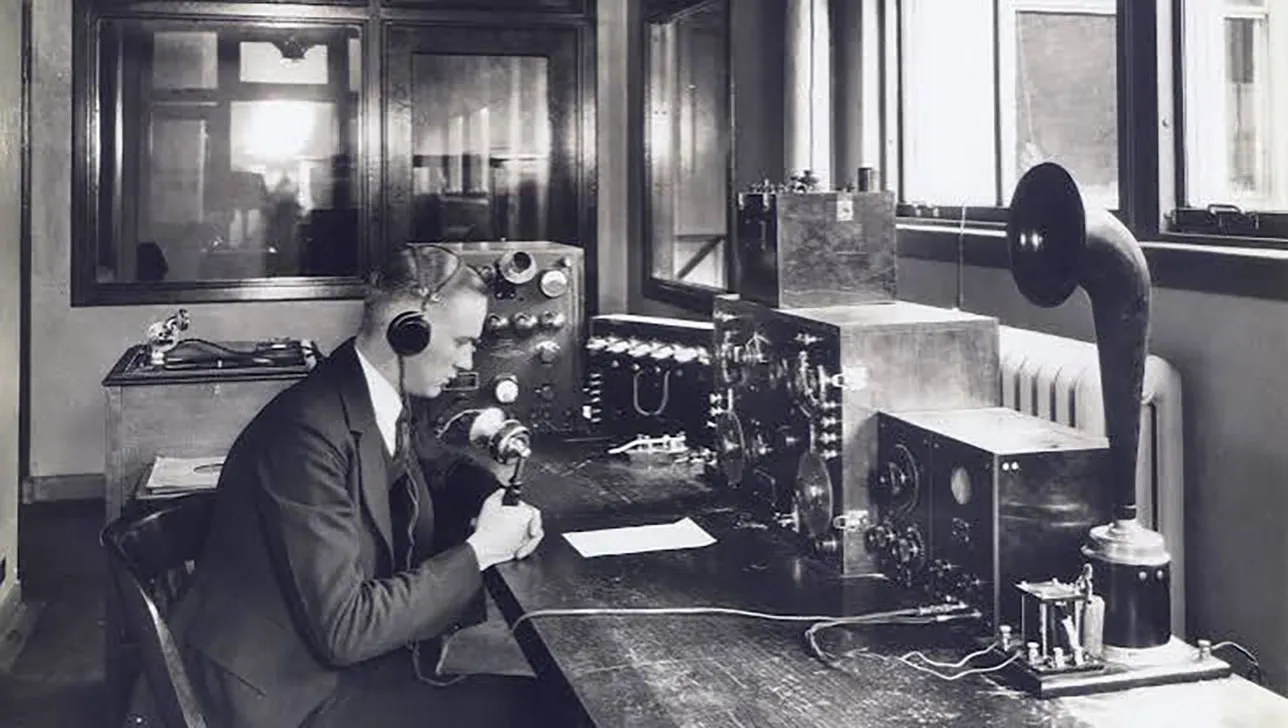 Fred Lathrop at the operator's desk of WWJ, the world's first licensed commercial radio station in approx. 1922.